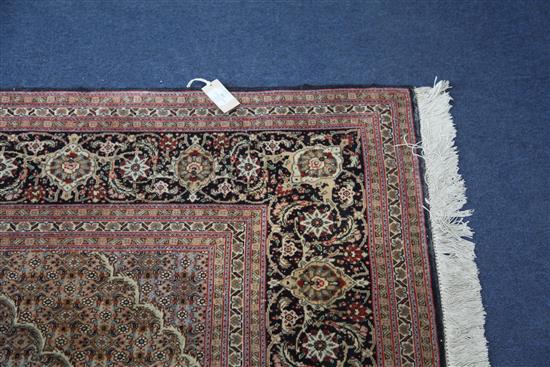 A central Persian carpet, 10ft by 6ft 8in.